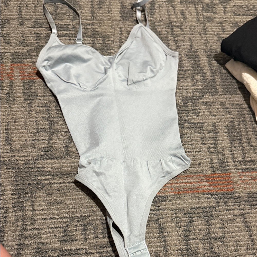 Light blue body suit